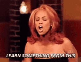 a woman with red hair is screaming and says learn something from this